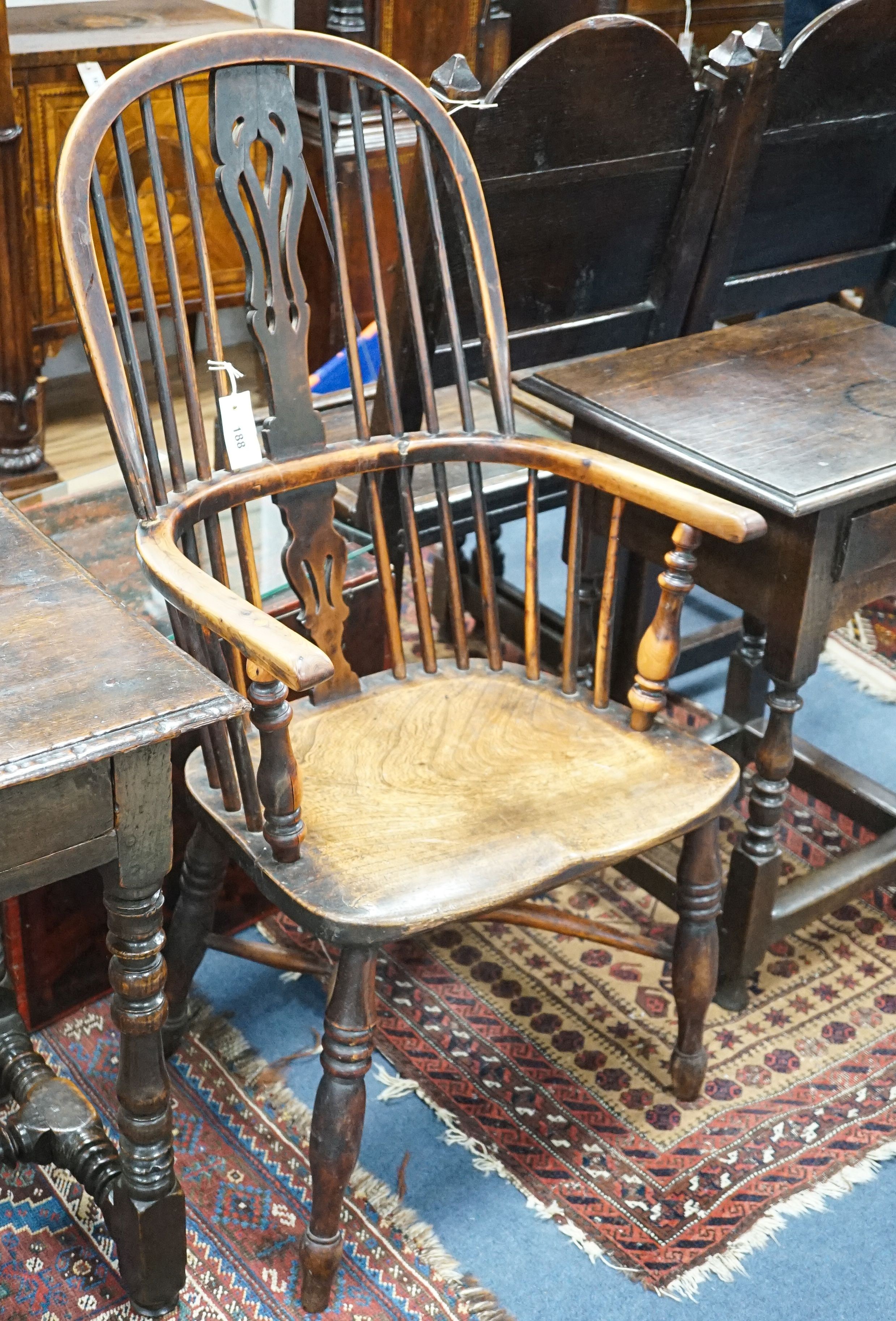 A 19th century Midlands area yew and elm Windsor armchair with crinoline stretcher, width 54cm, depth 40cm, height 108cm
